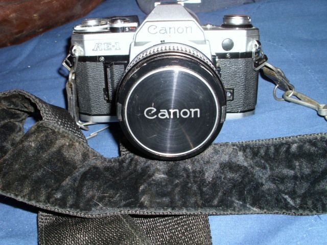 Canon AE 1 35 MM VTG Camera w/bag lots of Accessories  